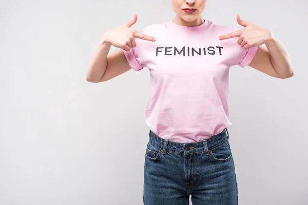 stock-photo-cropped-view-woman-pointing-pink-feminist-shirt-isolated-grey.jpg